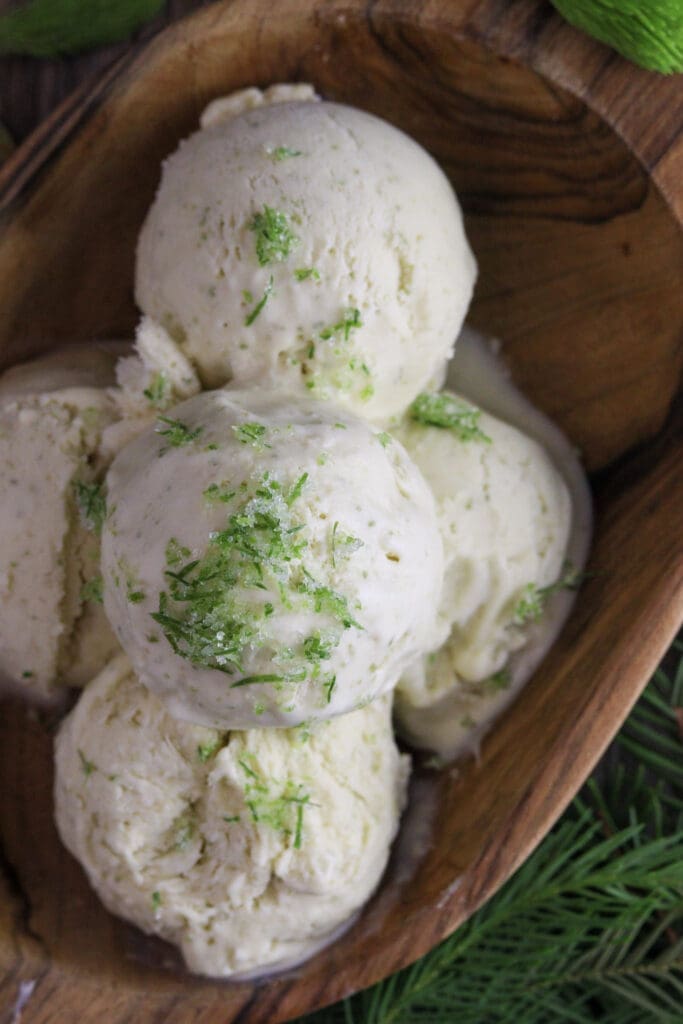 image of scooped spruce tip ice cream in a wooden bowl